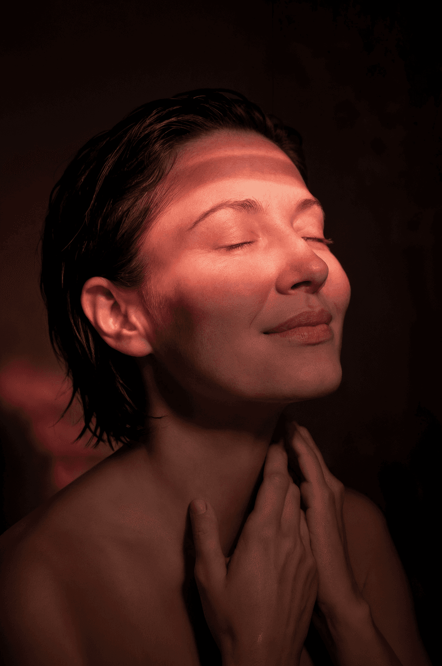 Woman with red light therapy glow